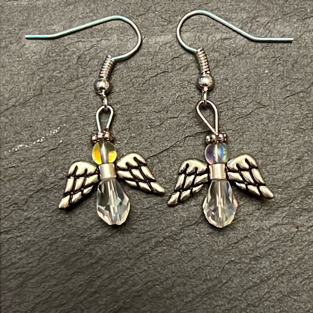 Handcrafted silver tone angel earrings with iridecent stones.